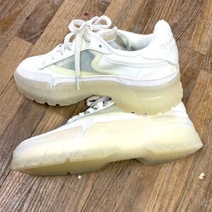 Cardi B translucent Reebok runners white shiny